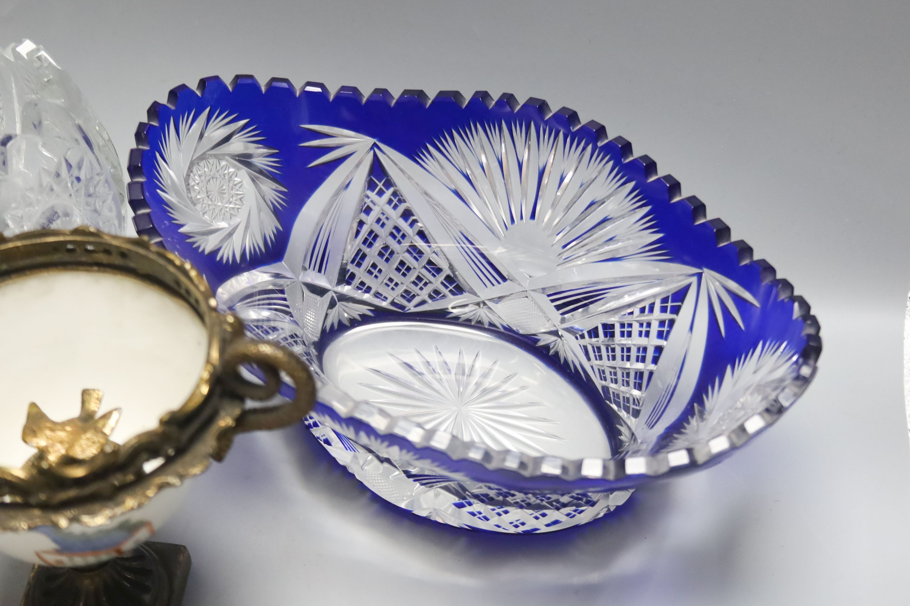 Two cut glass bowls and a Chinese brass mounted cup, 16cm